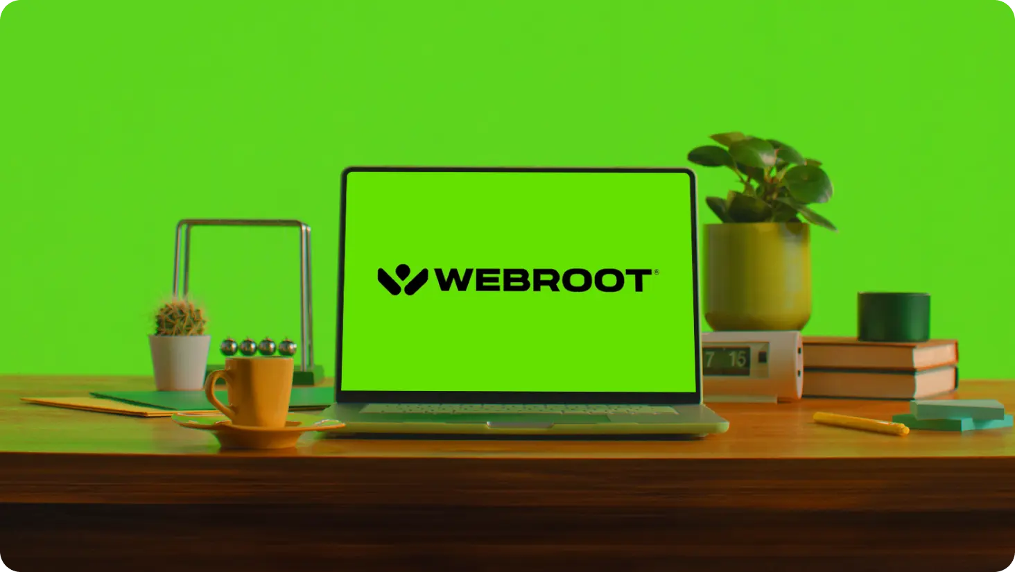 Laptop PC on a desk displaying Webroot logo.